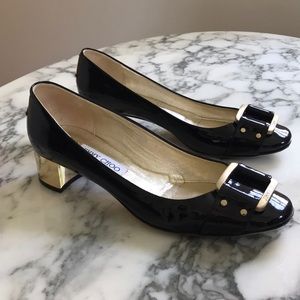 Jimmy Choo Black and Gold Pumps